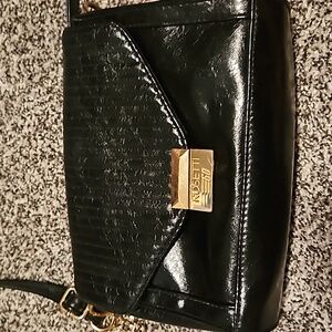 Rosetti Go. Black purse with gold. Good condition. Lots of places inside.